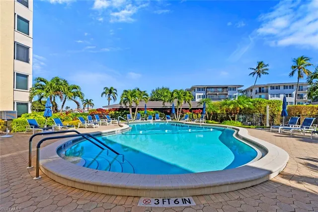 a view of a swimming pool with chairs
