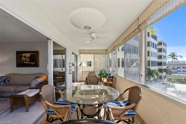 a dining room with furniture and window