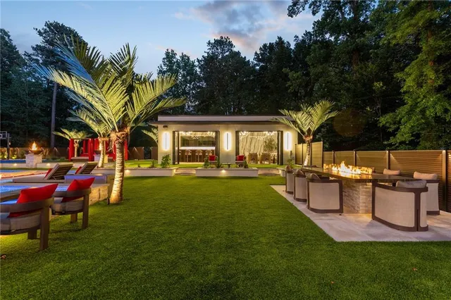 a view of a pool in a backyard