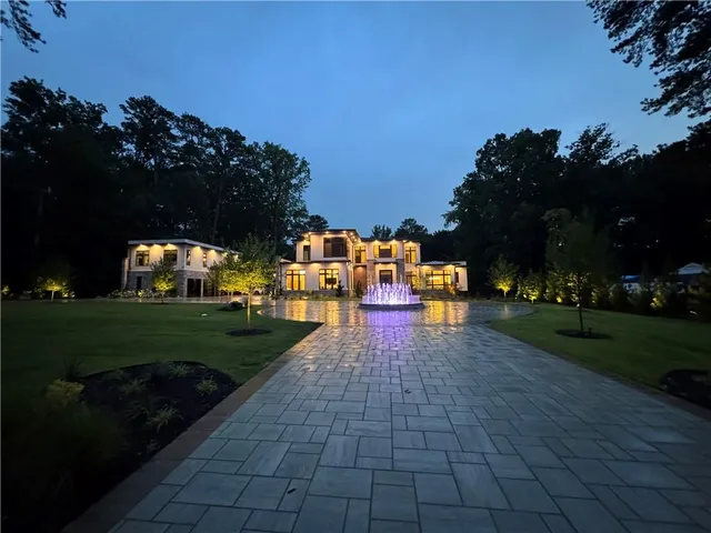 a view of a park with large trees