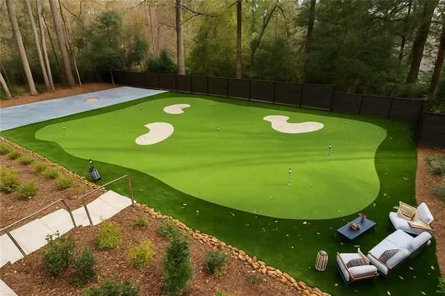 a room with lots of furniture and a chandelier