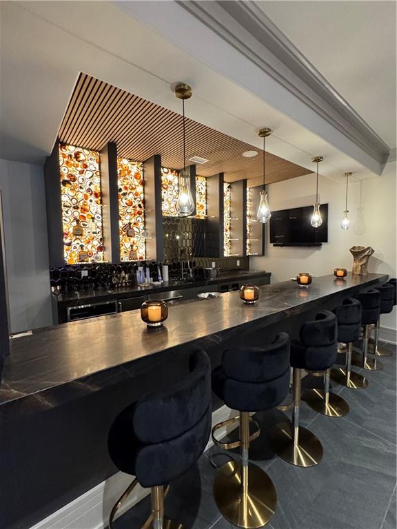 1386 Moores Mill Road Northwest Atlanta, GA 30327 - Photo 27 of 57 a kitchen with a table chairs sink and cabinets
