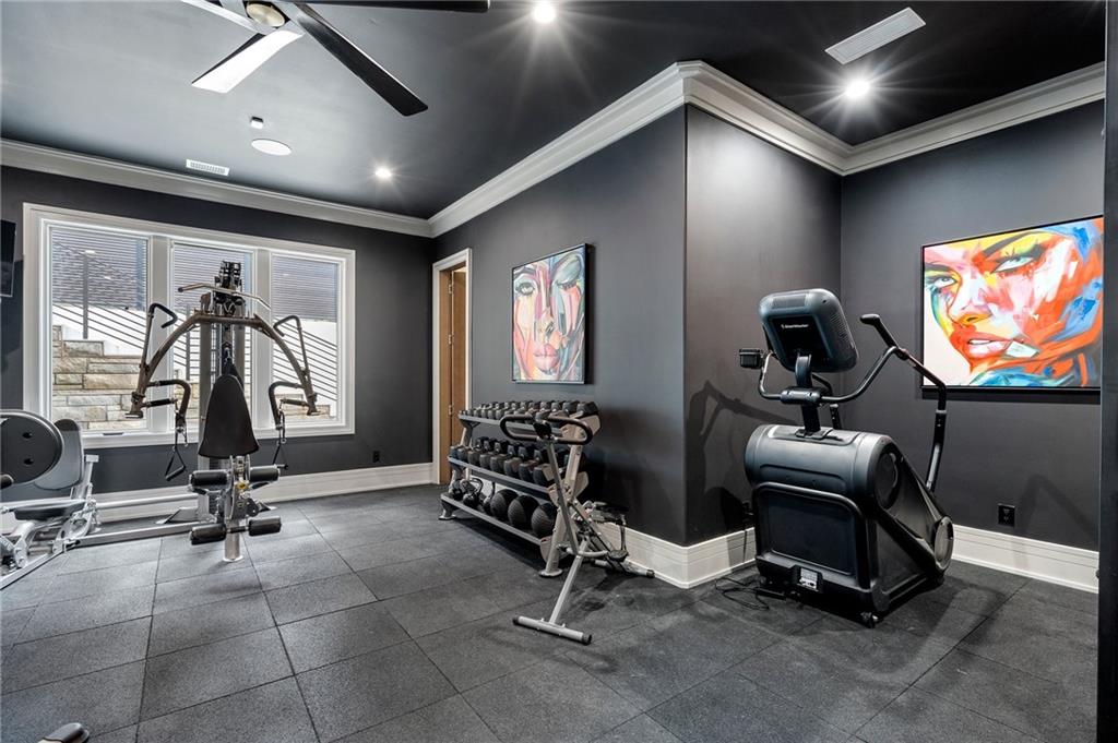 1386 Moores Mill Road Northwest Atlanta, GA 30327 - Photo 32 of 57 a view of a room with gym equipment