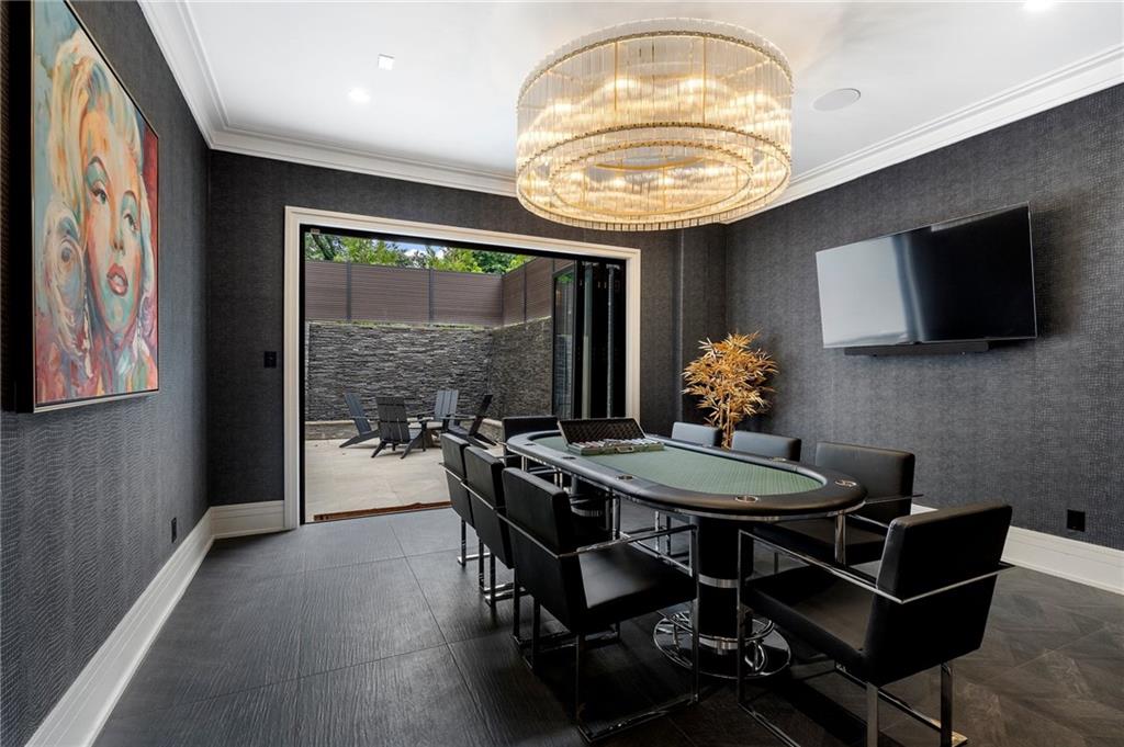 1386 Moores Mill Road Northwest Atlanta, GA 30327 - Photo 33 of 57 a view of a dining room with furniture window and outside view