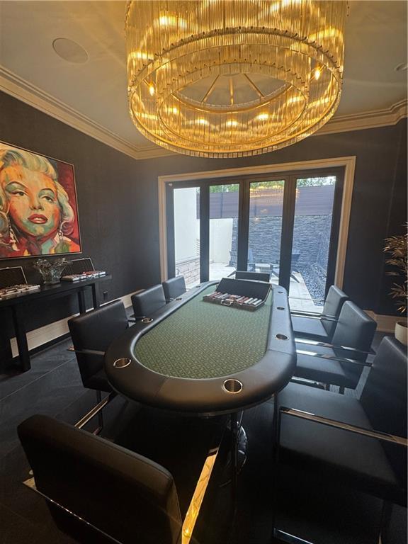 1386 Moores Mill Road Northwest Atlanta, GA 30327 - Photo 34 of 57 a living room with furniture and a chandelier