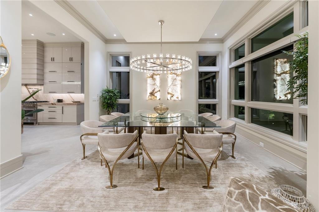 1386 Moores Mill Road Northwest Atlanta, GA 30327 - Photo 43 of 57 a view of a dining room with furniture window and outside view