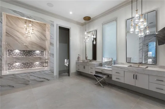 a bathroom with a granite countertop sink a toilet and shower