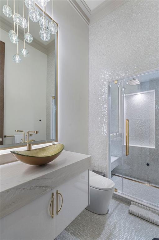 1386 Moores Mill Road Northwest Atlanta, GA 30327 - Photo 52 of 57 a bathroom with a granite countertop sink a toilet and shower