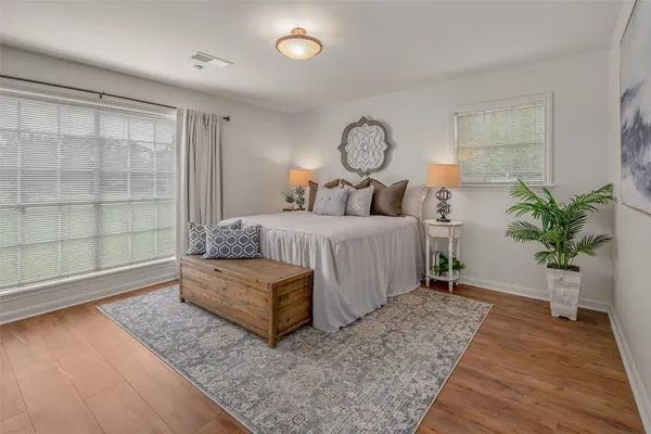 a view of dining room and livingroom with furniture wooden floor and a table