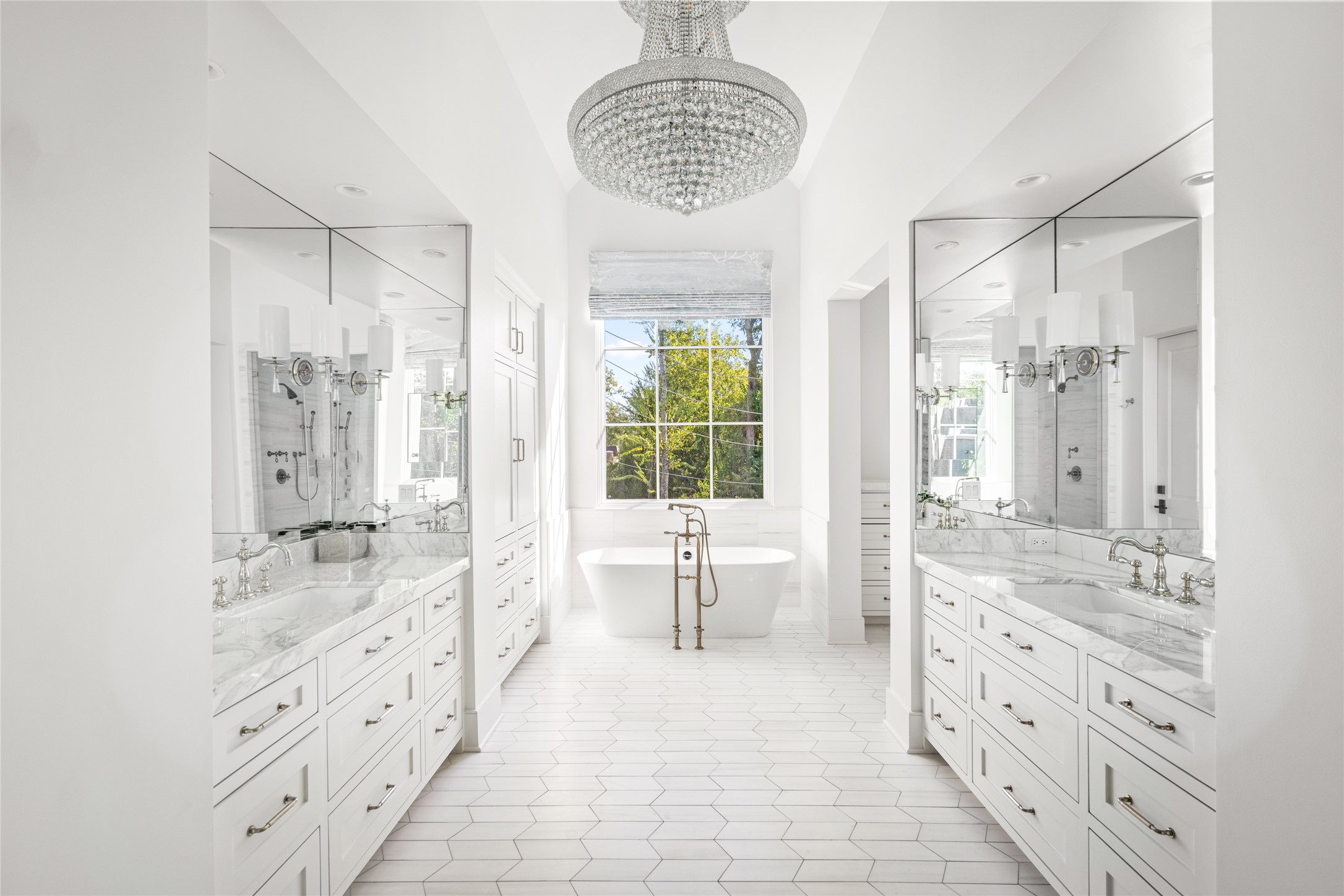 811 Creek Wood Way Houston, TX 77024 - Photo 20 of 49 a spacious bathroom with double vanity and a large mirror