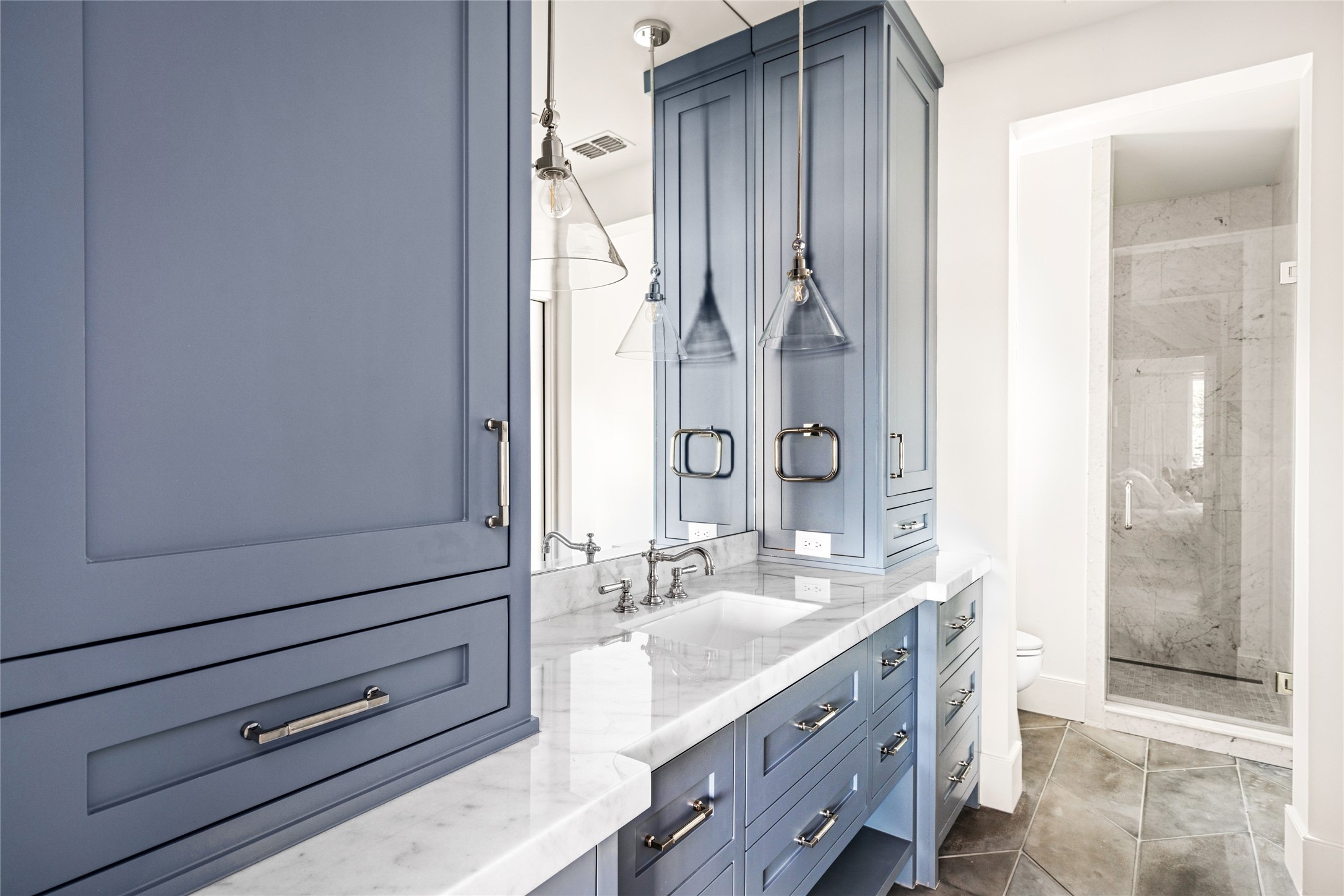 811 Creek Wood Way Houston, TX 77024 - Photo 41 of 49 a spacious bathroom with a granite countertop sink a mirror and a shower