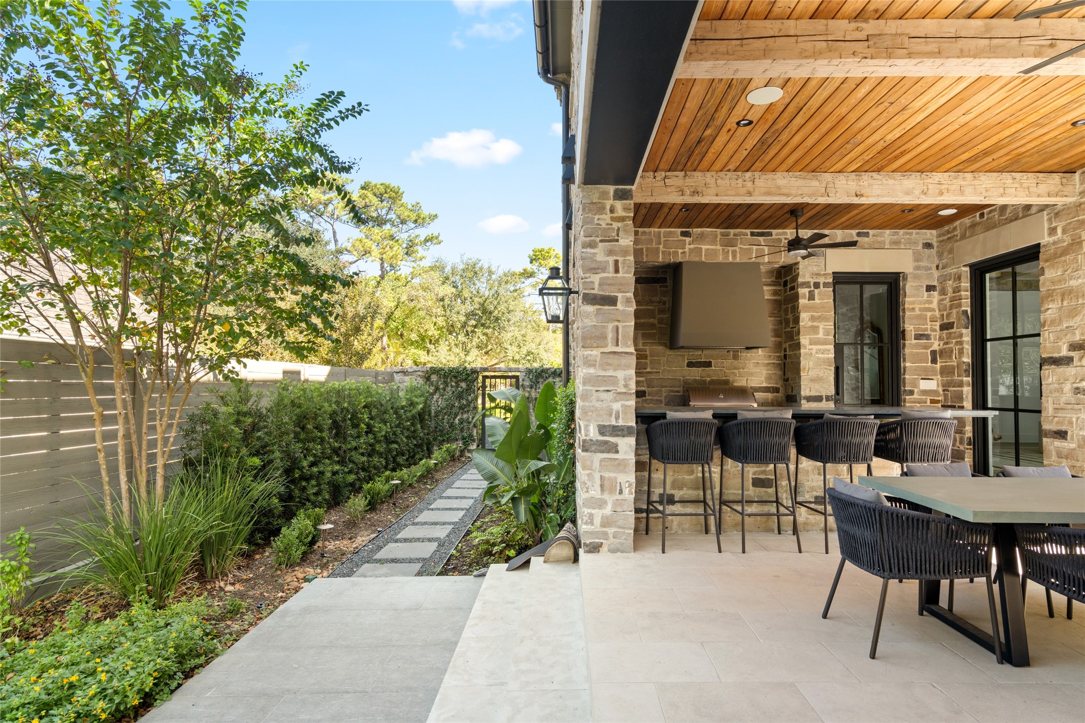 811 Creek Wood Way Houston, TX 77024 - Photo 46 of 49 a view of a patio with table and chairs and potted plants