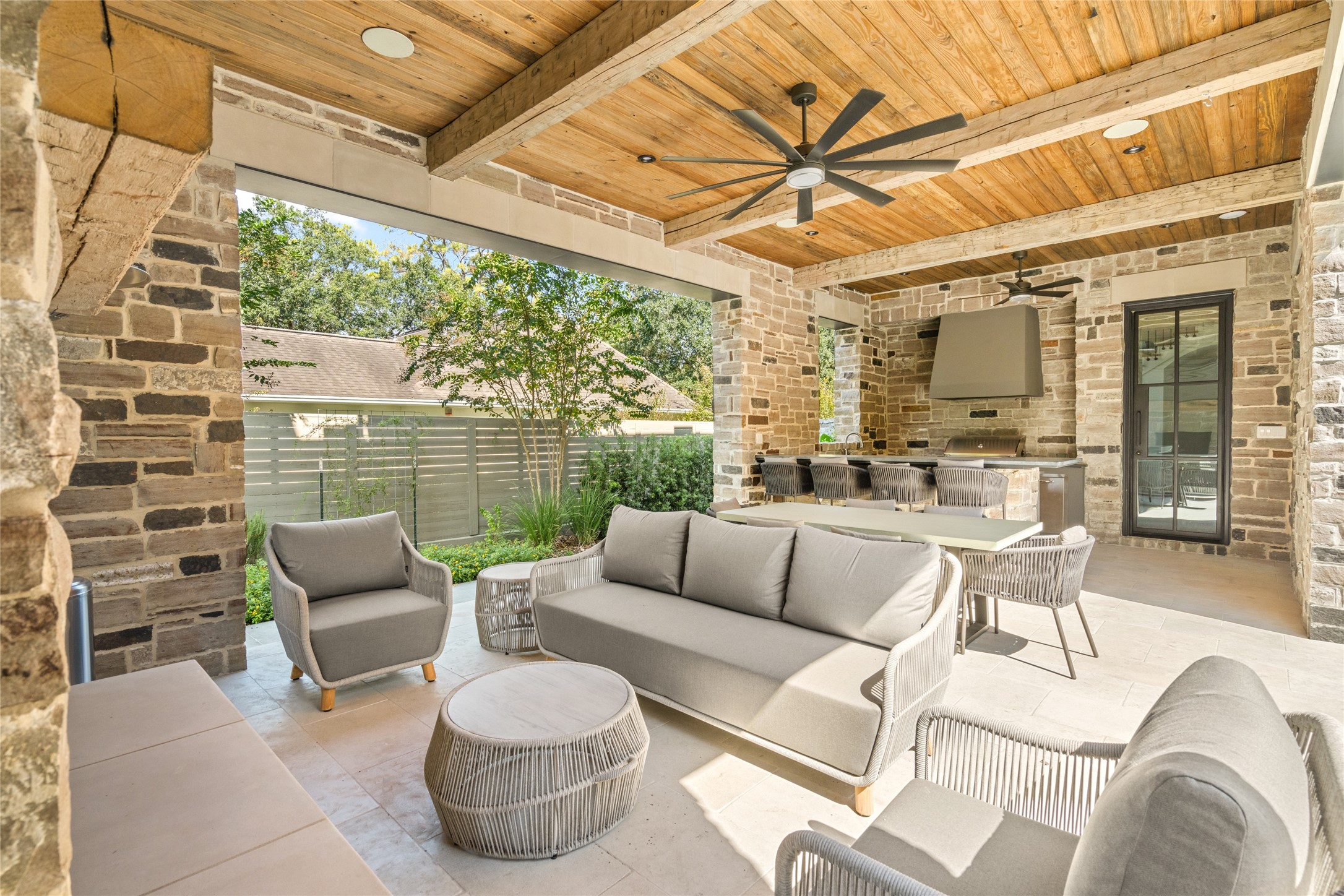811 Creek Wood Way Houston, TX 77024 - Photo 47 of 49 a view of a patio with couches chairs and a potted plant