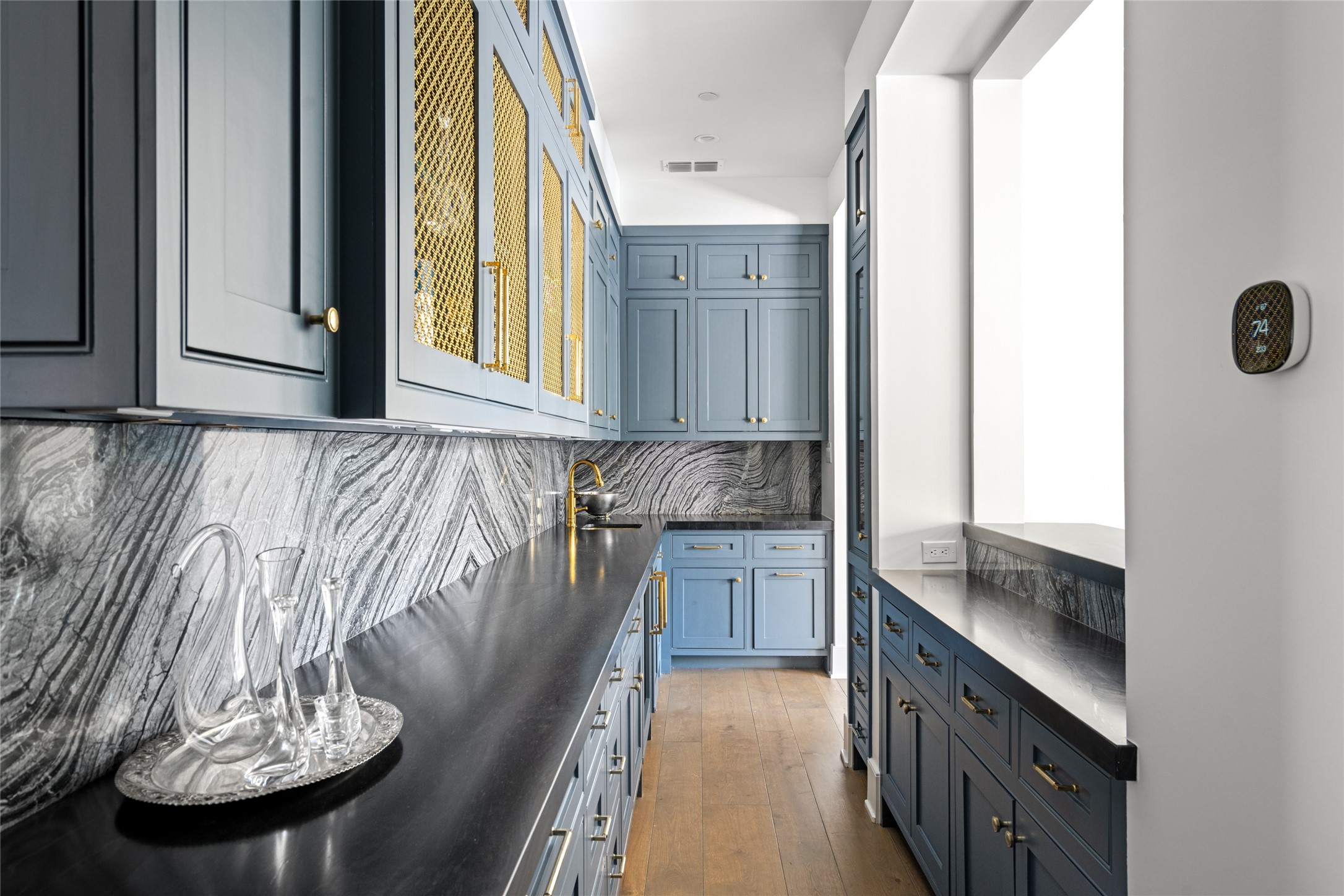 811 Creek Wood Way Houston, TX 77024 - Photo 6 of 49 a kitchen with a sink and a refrigerator