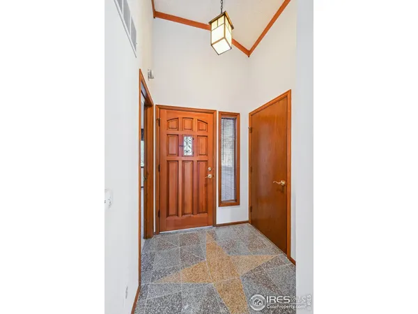 a view of a hallway with front door