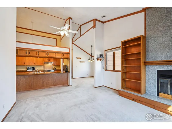 a kitchen with stainless steel appliances granite countertop a sink stove and wooden cabinets