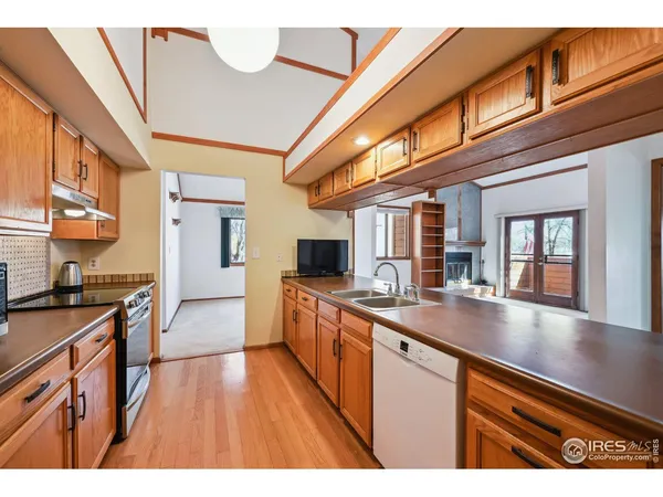 a kitchen with stainless steel appliances granite countertop a stove and a microwave