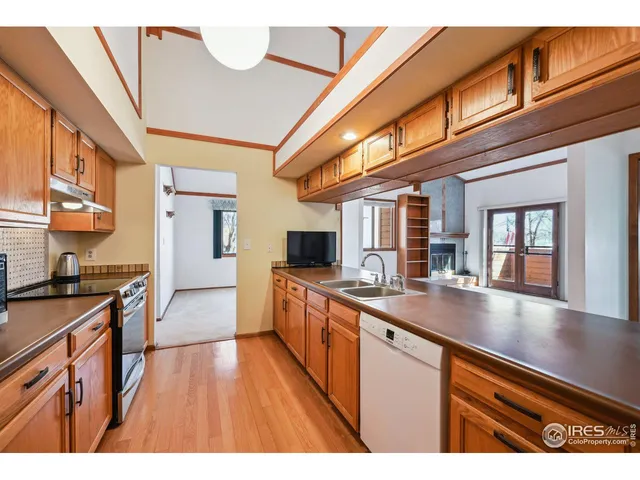 a kitchen with stainless steel appliances granite countertop a stove and a microwave