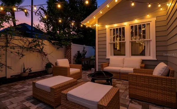 a outdoor living space with furniture and a potted plant