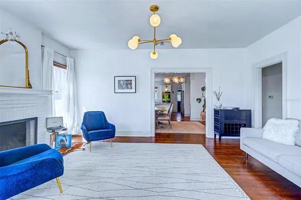 a living room with furniture and a fireplace
