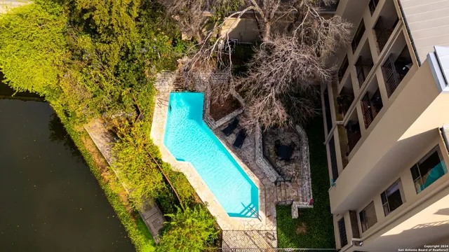 a view of swimming pool with a patio