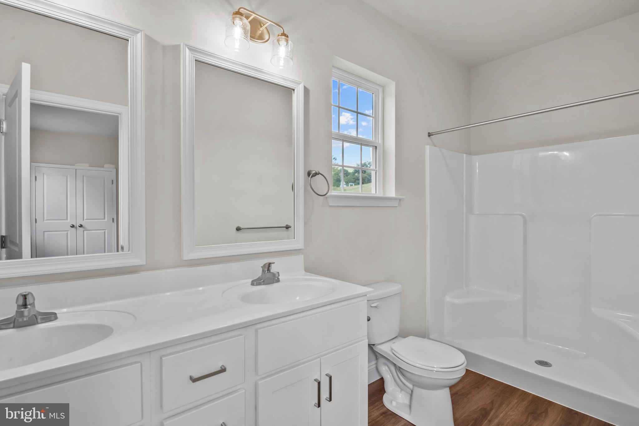 8 Country Club Road Ashland, PA 17921 - Photo 11 of 18 a bathroom with a sink toilet double vanity and shower