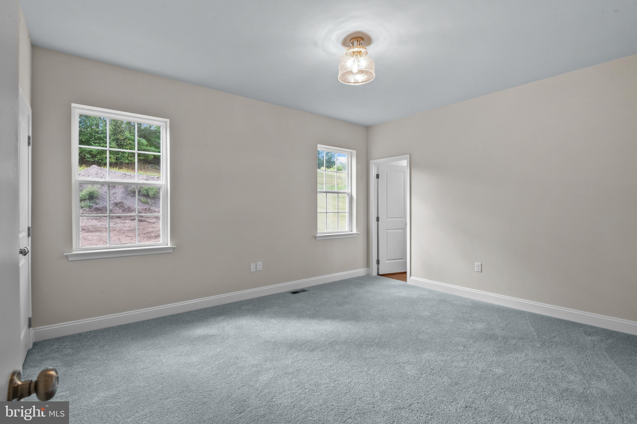 8 Country Club Road Ashland, PA 17921 - Photo 13 of 18 an empty room with windows and fan