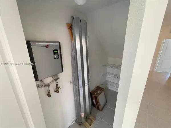 a view of a house with swimming pool and sitting area