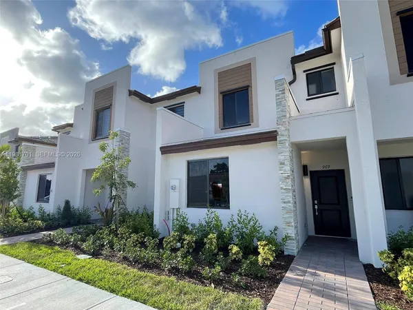 a view of a swimming pool with a table and chairs