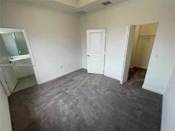 an empty room with a bathroom