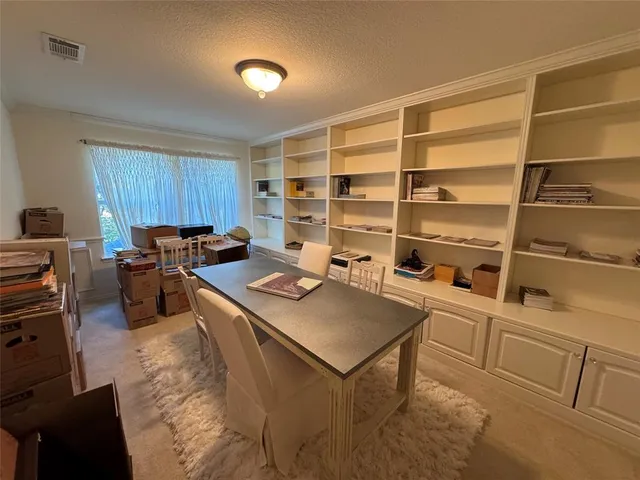 a kitchen with a stove a refrigerator and a counter top space