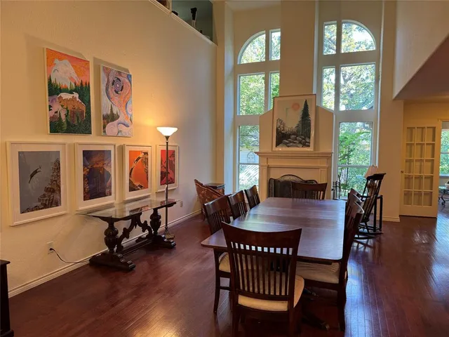 a view of a a dining room with furniture window and wooden floor