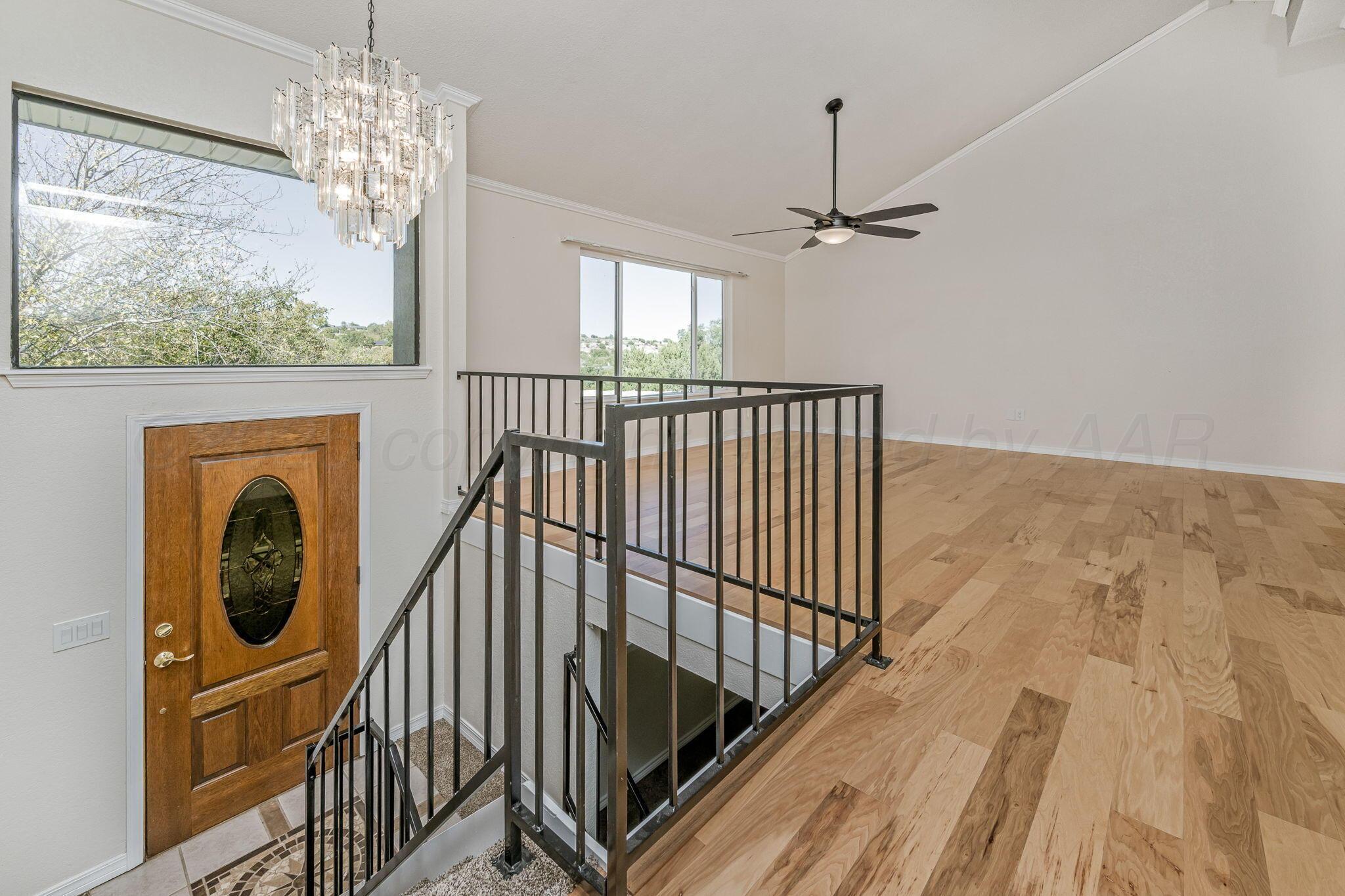 101 Mathis Drive Amarillo, TX 79118 - Photo 12 of 36 a view of entryway and hall with wooden floor