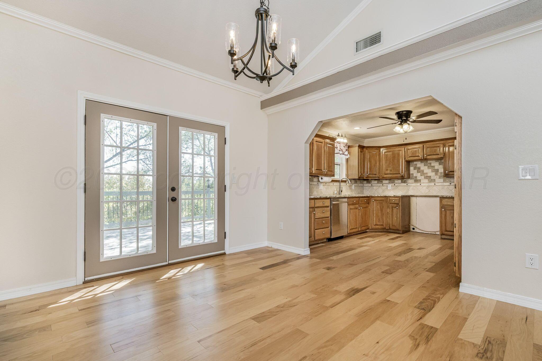 101 Mathis Drive Amarillo, TX 79118 - Photo 15 of 36 a view of a kitchen with a sink and wooden floor