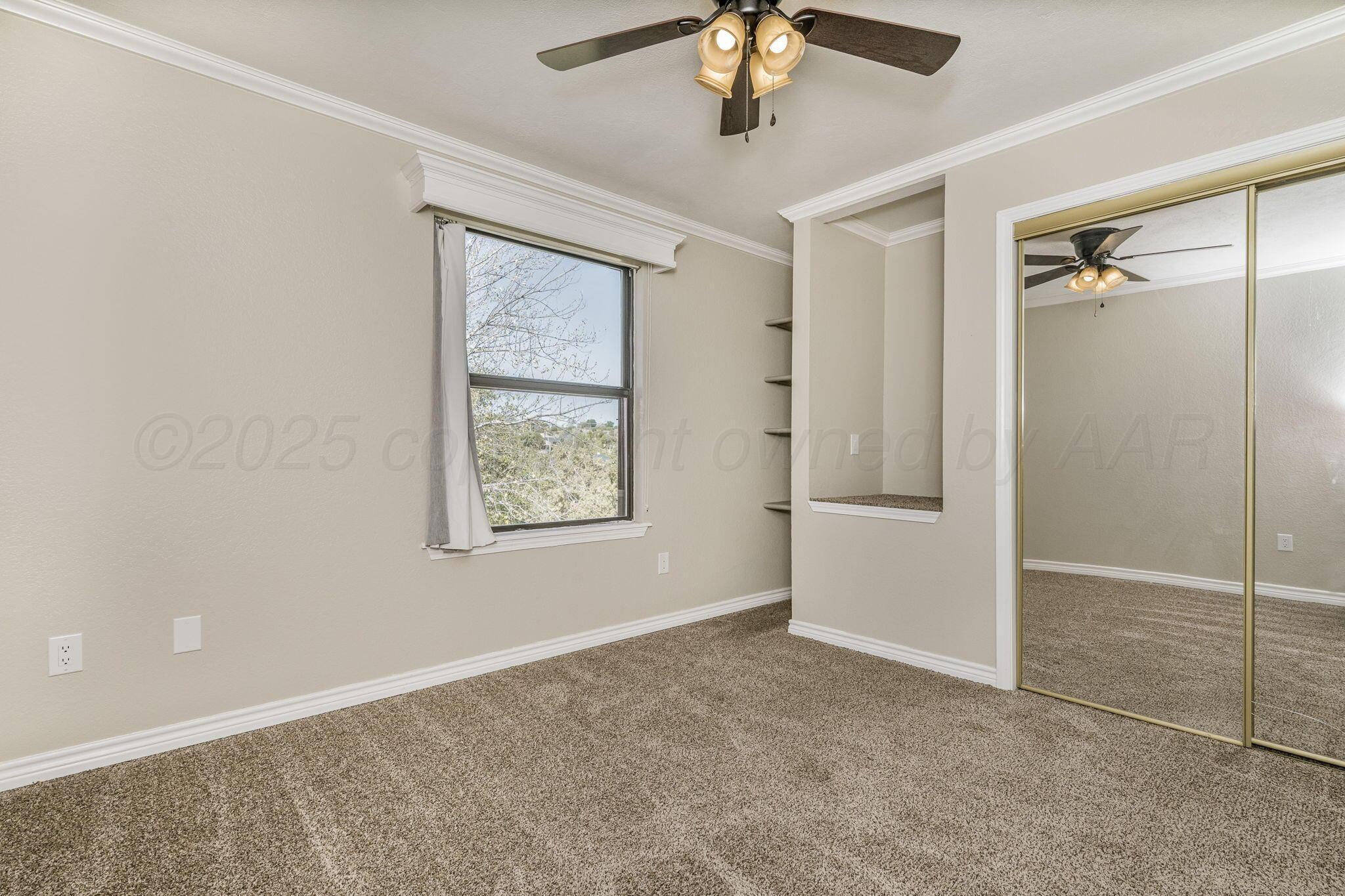 101 Mathis Drive Amarillo, TX 79118 - Photo 20 of 36 a view of an empty room with a window