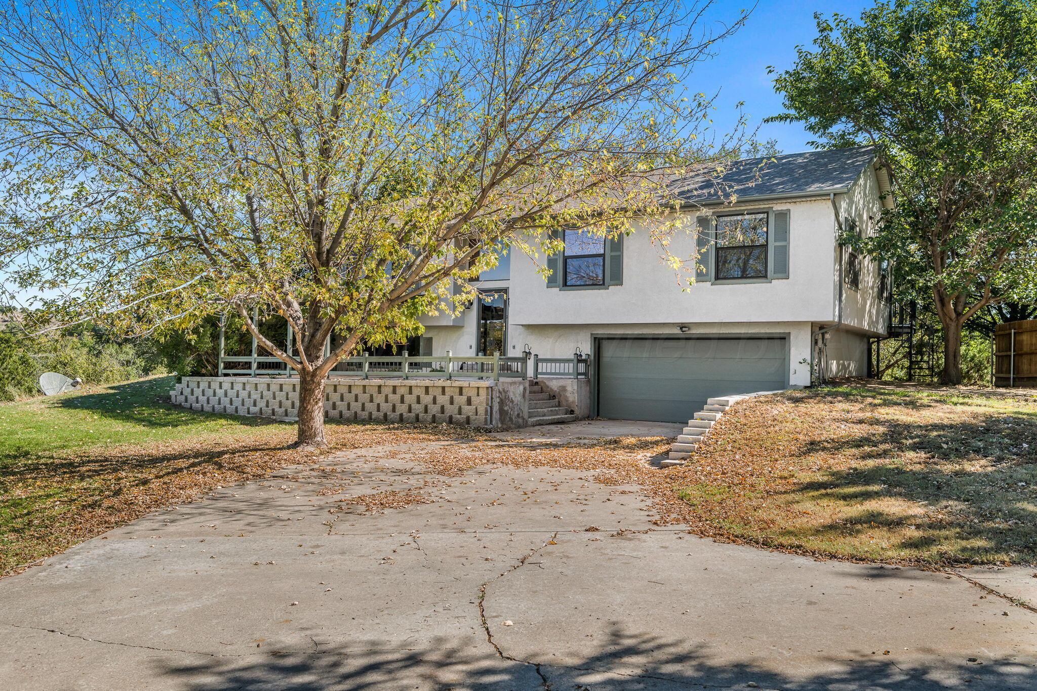 101 Mathis Drive Amarillo, TX 79118 - Photo 2 of 36 a view of a house with a yard covered in snow
