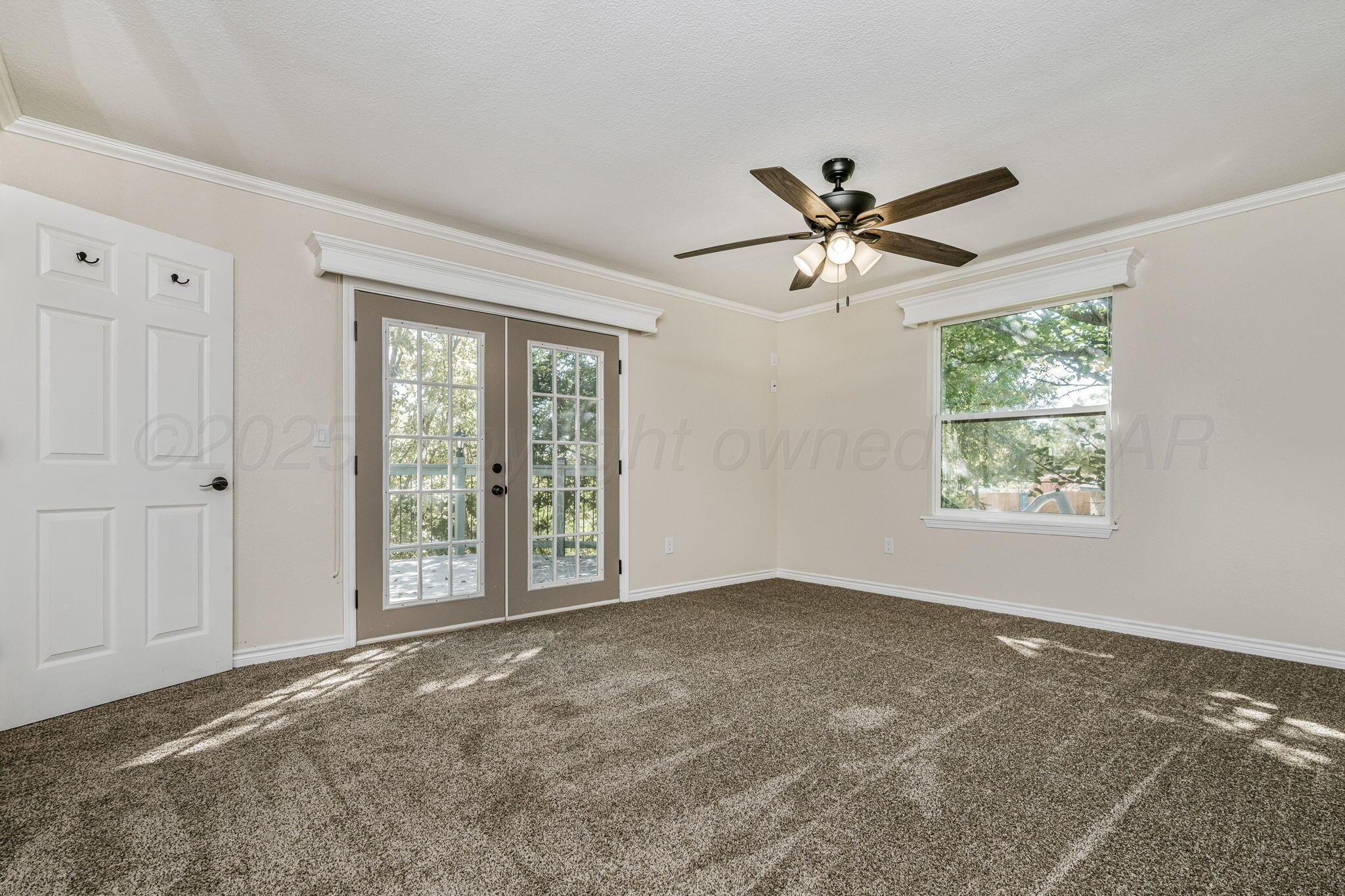 101 Mathis Drive Amarillo, TX 79118 - Photo 22 of 36 a view of a livingroom with a ceiling fan and window
