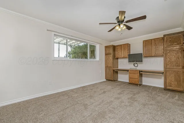 a view of a kitchen with sink cabinet and a window