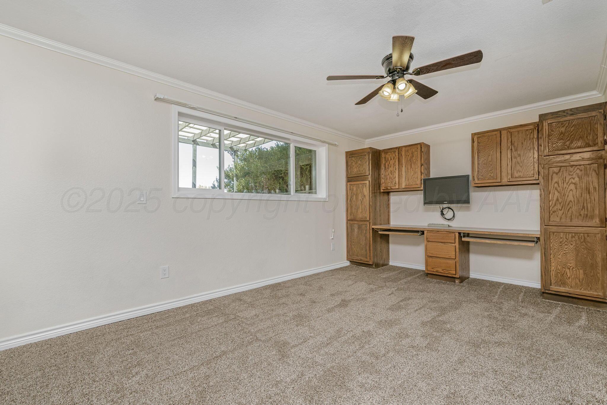 101 Mathis Drive Amarillo, TX 79118 - Photo 24 of 36 a view of a kitchen with sink cabinet and a window