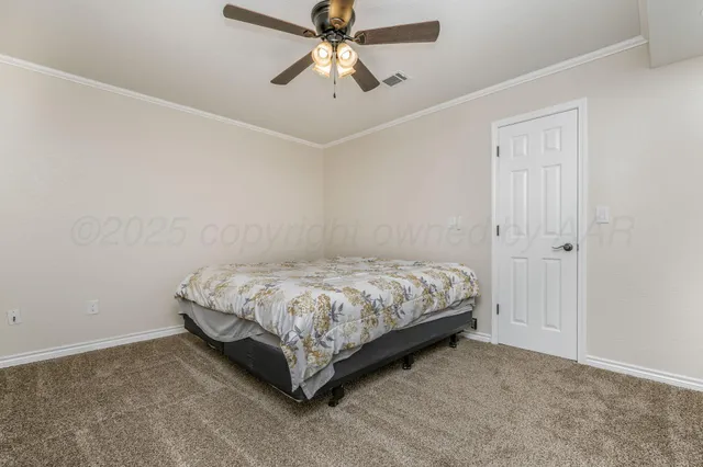a bedroom with a bed and a ceiling fan