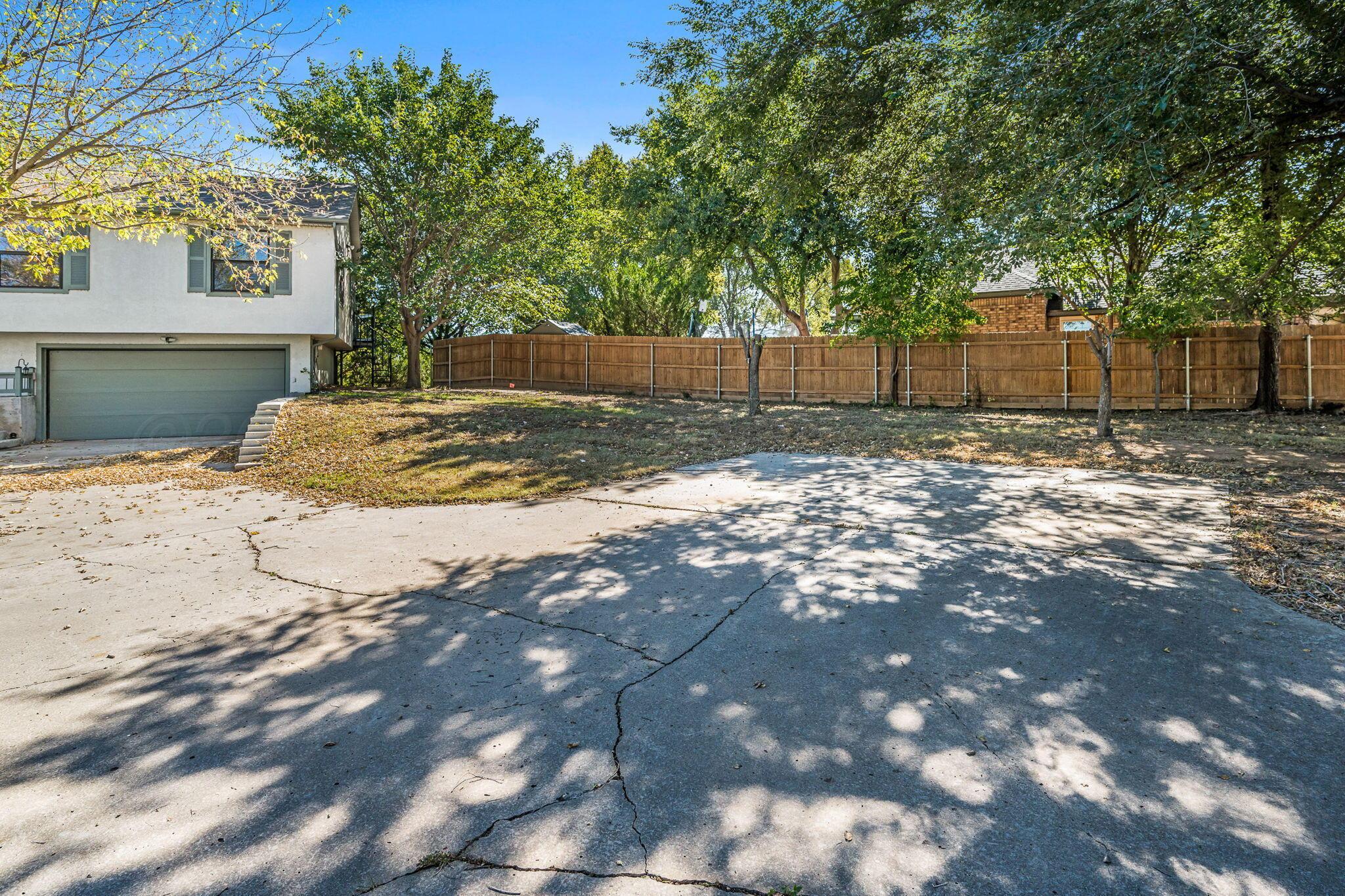 101 Mathis Drive Amarillo, TX 79118 - Photo 3 of 36 a view of a yard with a tree