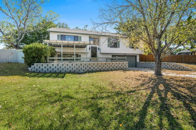 a view of house with a yard