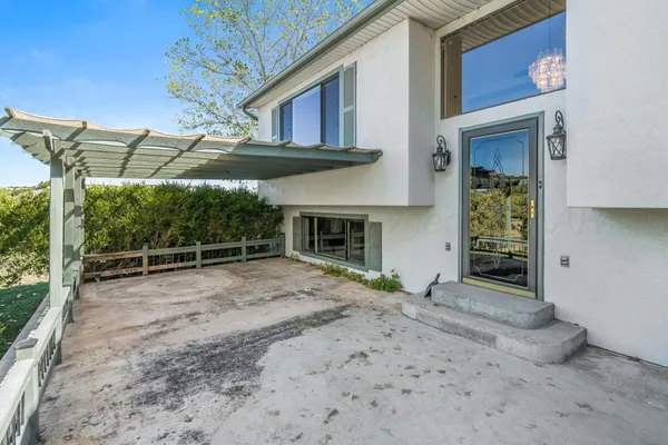 a view of a house with a backyard and fireplace