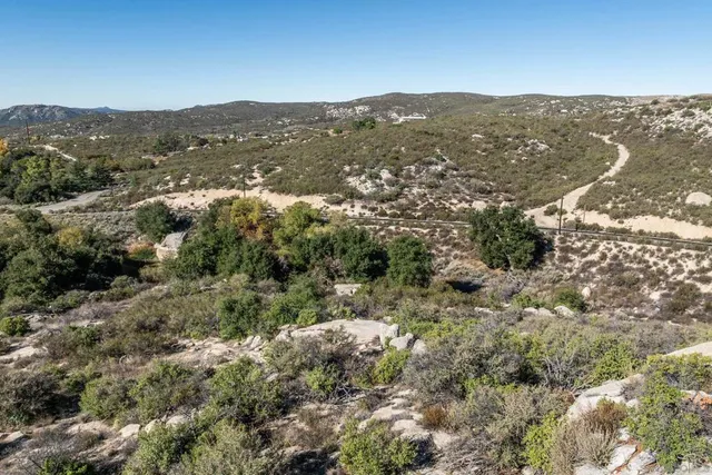 an aerial view of a house with a lake view