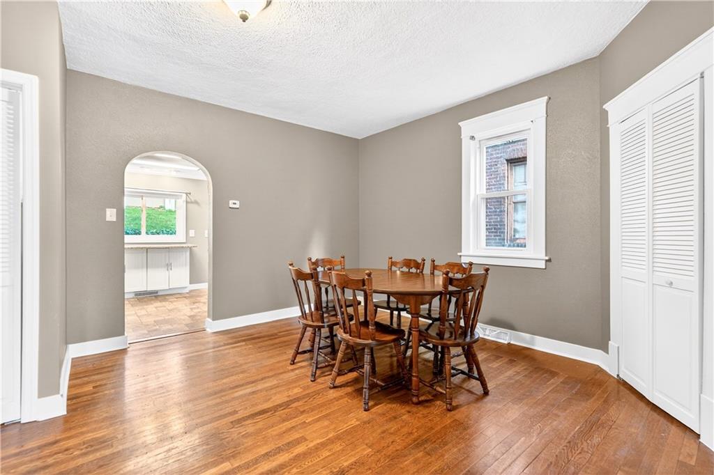 554 North Elm Street Butler, PA 16001 - Photo 11 of 31 a view of a dining room with furniture and wooden floor