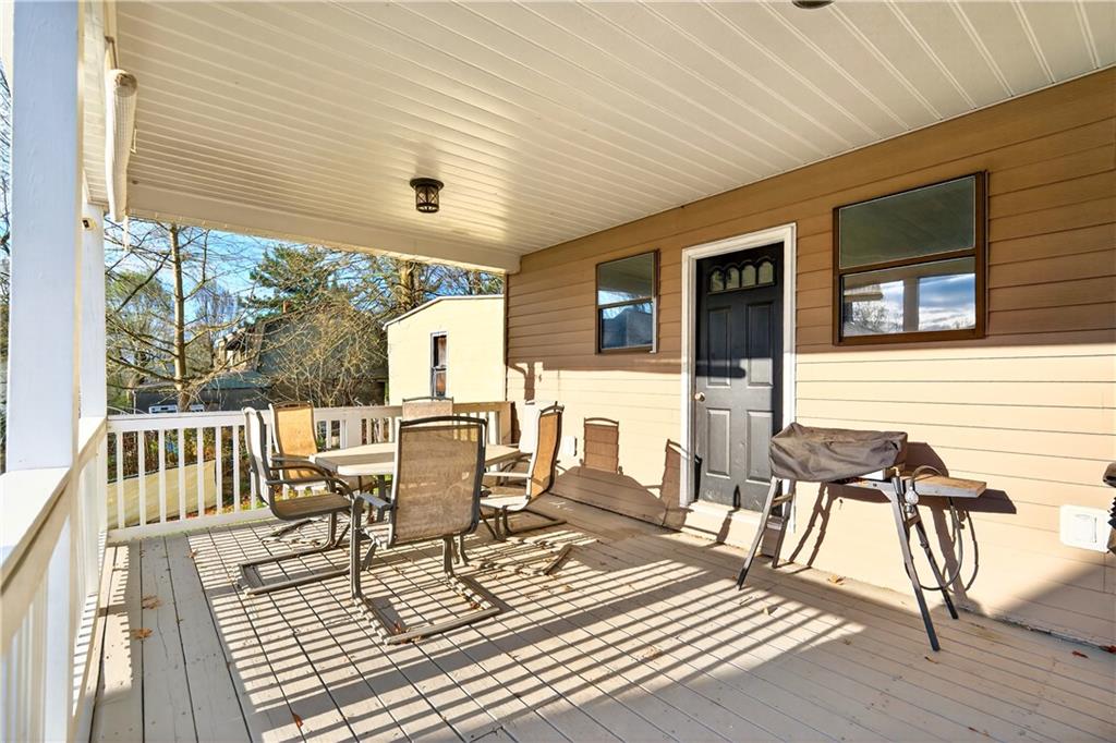 554 North Elm Street Butler, PA 16001 - Photo 26 of 31 a view of a patio with table and chairs with wooden floor and fence