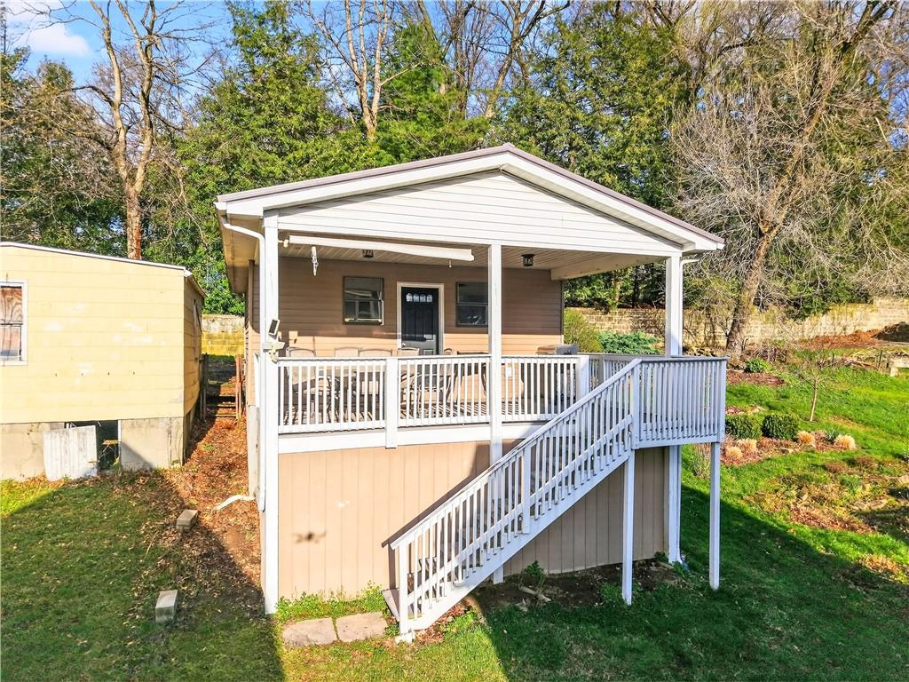554 North Elm Street Butler, PA 16001 - Photo 4 of 31 a view of a house with a yard and deck
