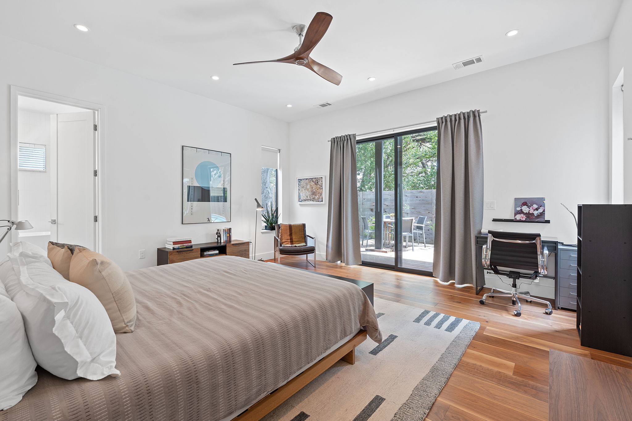 1605 Chelsea Lane, Unit 1 Austin, TX 78704 - Photo 13 of 38 Bedroom with access to exterior, light wood-type flooring, an office area, recessed lighting, and a ceiling fan