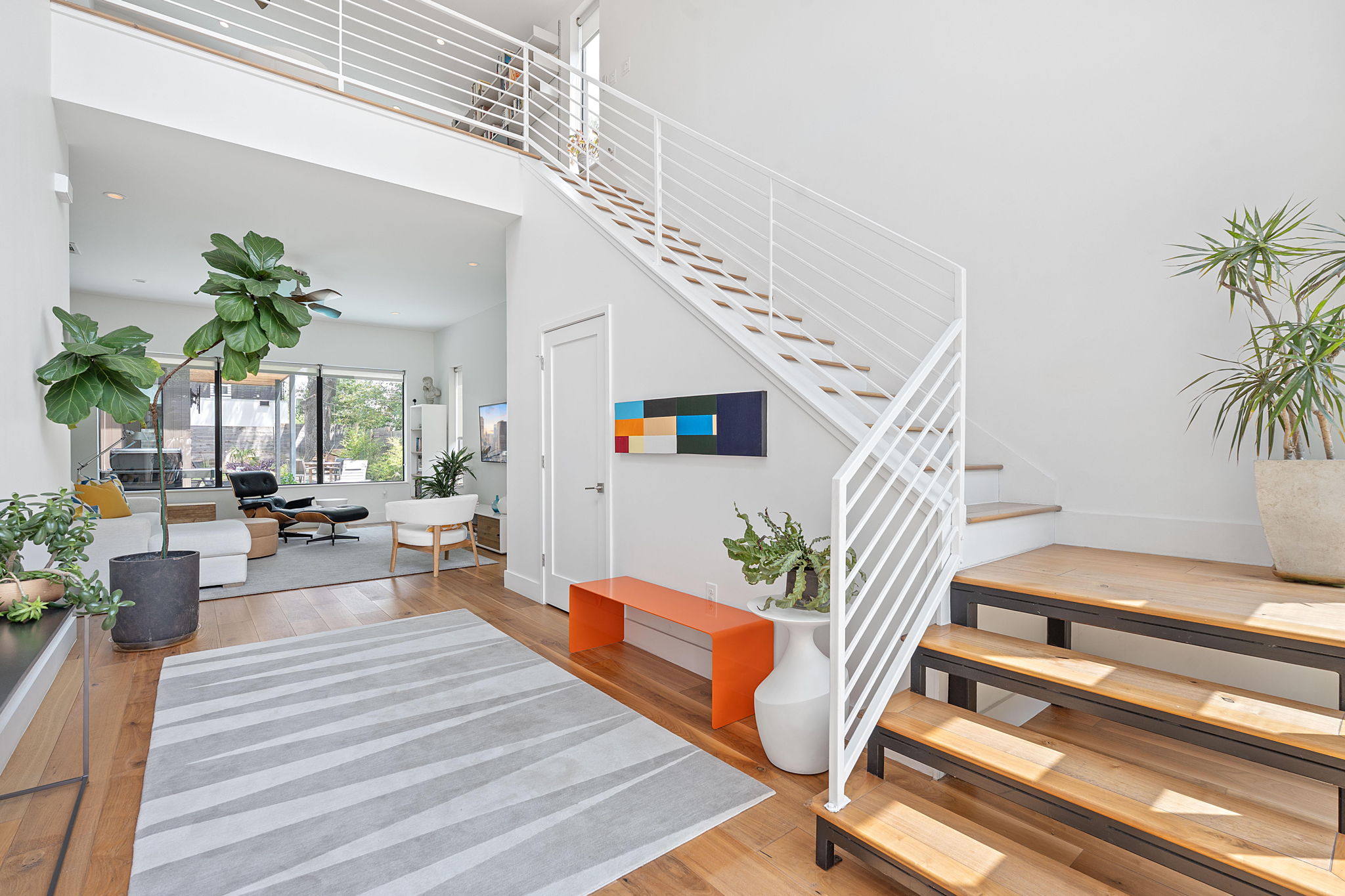 1605 Chelsea Lane, Unit 1 Austin, TX 78704 - Photo 17 of 38 Stairs with wood finished floors and a high ceiling