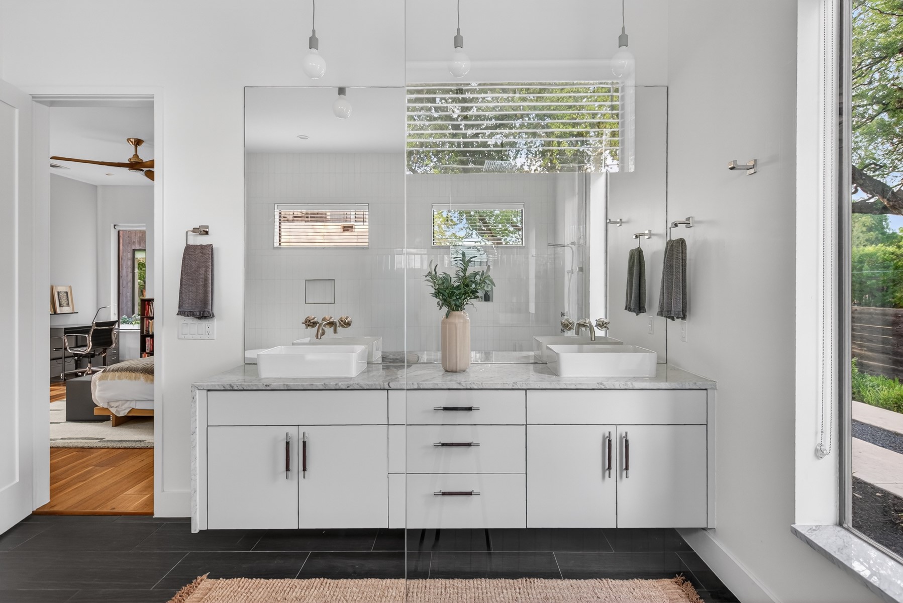 1605 Chelsea Lane, Unit 1 Austin, TX 78704 - Photo 19 of 39 a bathroom with a granite countertop sink and a mirror